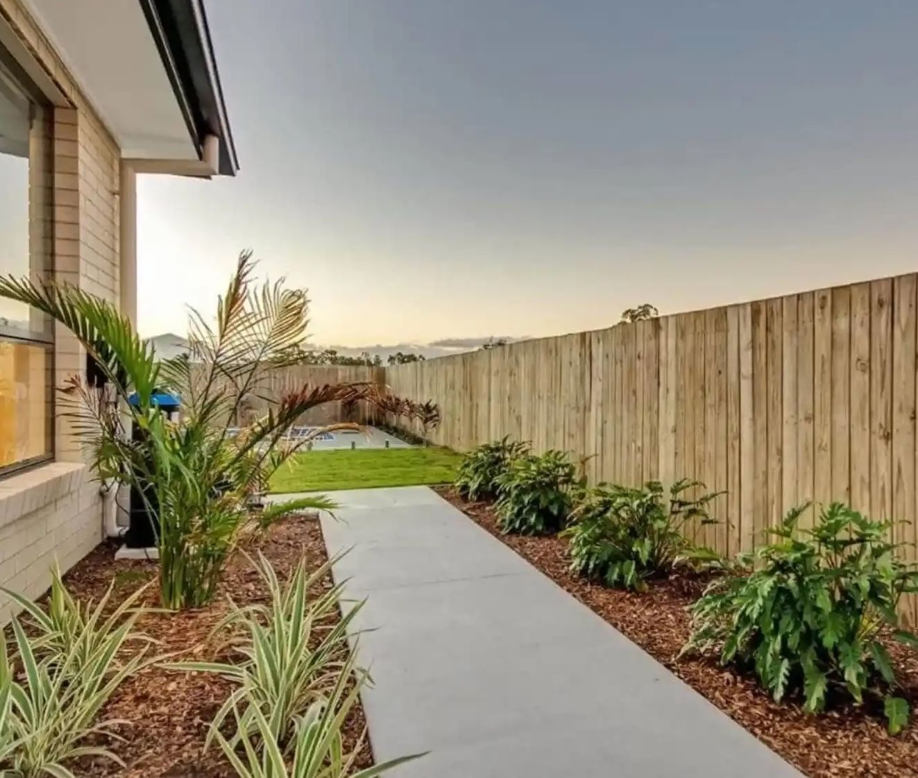 Home Concrete footpath along the side of a home